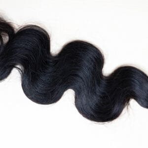 Wavy black hair extension with blue band.