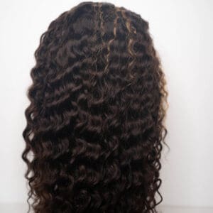 Curly hairpiece with defined texture displayed.