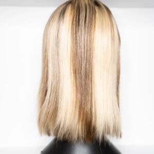 Short blonde bob hairstyle displayed on mannequin.