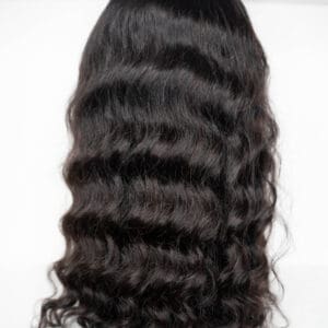 Wavy black hairpiece styled on mannequin head.